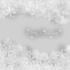 Christmas background. Borders made of fluffy snowflakes with text on soft gray background.
