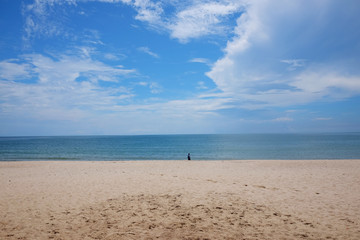 Fototapeta na wymiar Beach and blue ocean and clear blue sky in Thailan