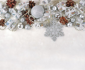 Silver Christmas decorations on a white