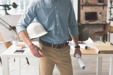 Elegant professional architect is posing in office