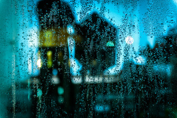 Rain drop on the glass with refection.