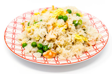 Homemade Chinese fried rice with vegetables and fried eggs