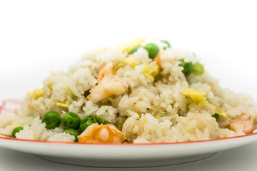Homemade Chinese fried rice with vegetables and fried eggs