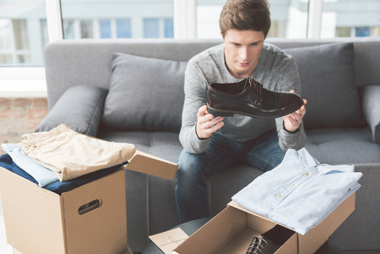 Serene male looking at footwear