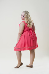 Plus size fashion model, overweight fat woman in dress