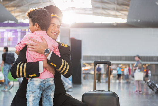 Little boy meeting father-airman in airport