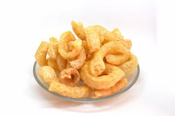 Pork cracklings on white background for traditional north Thai food concept.