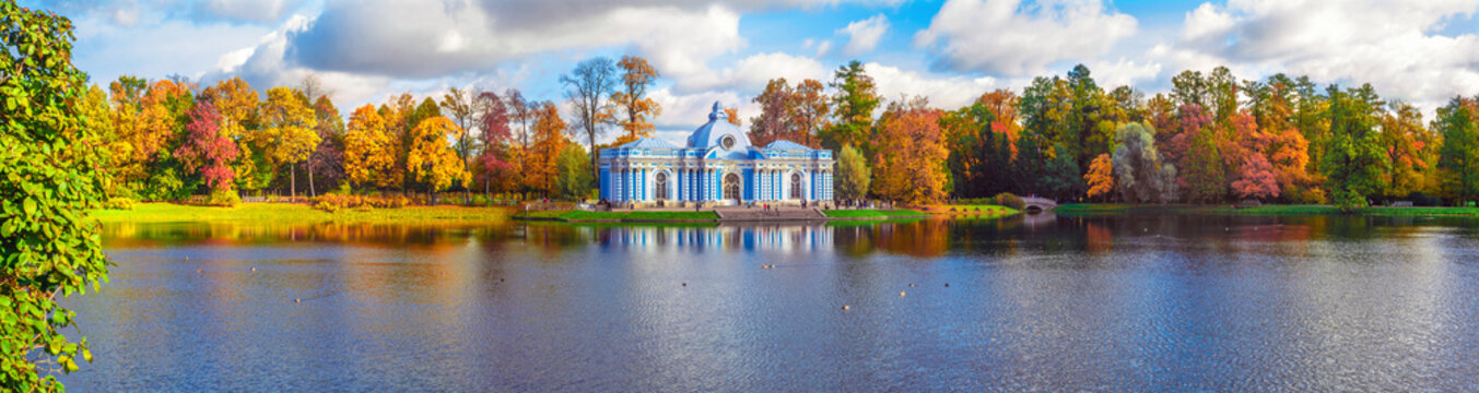 Autumn landscape with view over a Large pond, garden pavilion "Grotto" and the humpback bridge in the Catherine Park of Pushkin