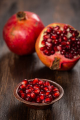 Pomegranate fruit on wooden vintage background
