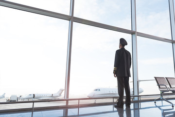 Adult aviator looking at planes