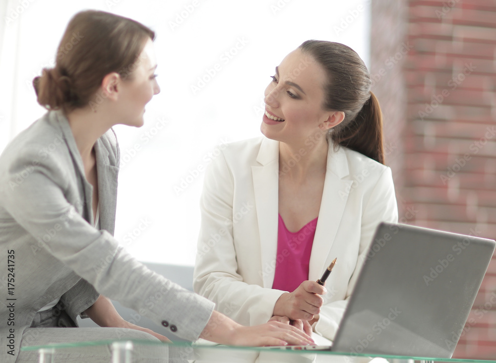 Wall mural two successful business women discussing current issues