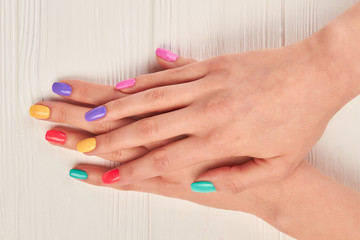 Obraz na płótnie Canvas Female hands with bright summer manicure. Woman hands with pastel polish on nails. female hands with summer colorful manicure.