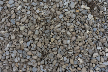 big stone heap in garden with earth for construction pile