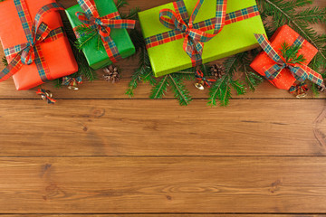 Colorful present boxes for any holiday on wooden background