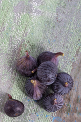 a pile of figs lying on old vintage wooden table