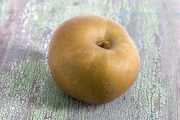 Rennet apples variety with a pleasant mild dry flavouron wooden background