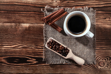 pie on bedding with the cup of coffee on a background a wooden table