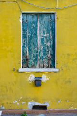 old houses with scraped walls and window