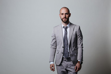 Stylish brutal manager, shot in studio, business coach, white background