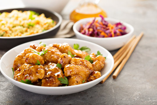 Spicy sweet and sour chicken with rice and cabbage