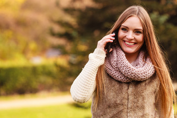 Woman walking in park during autumn