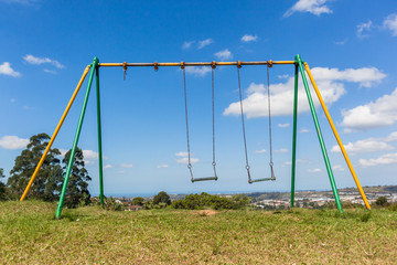 Fototapeta na wymiar Playground Chain Swing Chairs Landscape