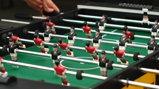 Guys playing table football