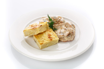 Delicious lunch. Casserole with mushroom sauce on white