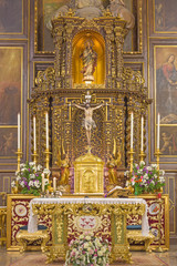 CORDOBA, SPAIN - MAY 27, 2015: The carved polychrome main altar of church Convento de Capuchinos (Iglesia Santo Angel).
