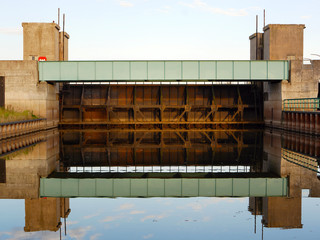Floodgate at Havelberg, Germany, reflected in the water