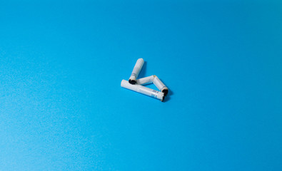 A top view image of several commercially made cigarettes.