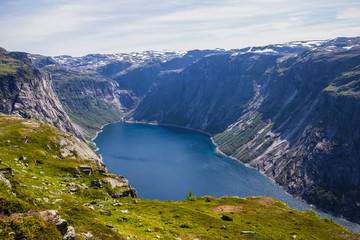 Naklejka na ściany i meble The summer trip to Trolltunga (The Troll's tongue) in Odda ( Ringedalsvatnet lake, Norway).