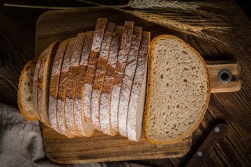 Sliced loaf of bread on a chopping board.