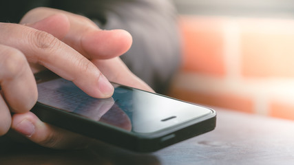 Female Hand Finger Holding And Touching On Mobile Smartphone 