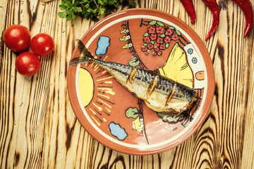  Mackerel baked with lemon on plate, garlic,Baked fish,Whole baked mackerel or scomber fish with lemon,healthy baked fillet of mackerel ,Grilled fish
