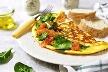 Omelette stuffed with spinach and salted salmon.