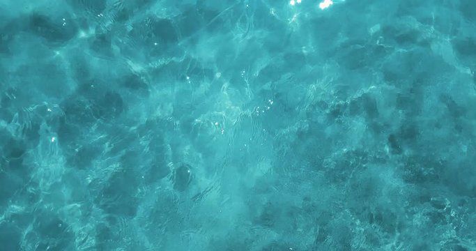 top of view of blue tropical caribbean sea with, texture effect background, wave movement seamless loop ready