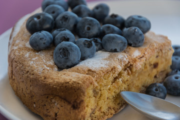 White plate with blueberry cake