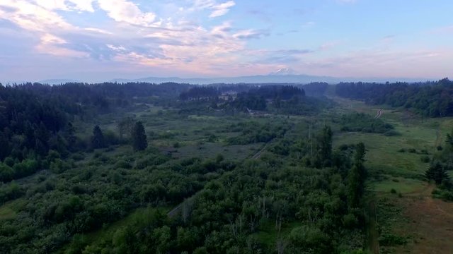 Beautiful aerial of northwest countryside with mount Rainier on the horizon early in the morning, beautiful, peaceful and tranquil image of the northwest nature.