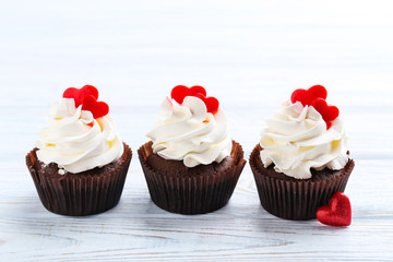 Chocolate cupcakes on a white wooden table
