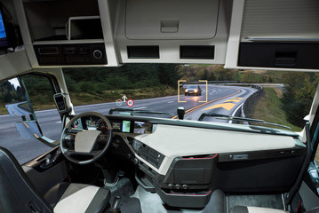 Self driving truck with head up display on a road. Inside view. © scharfsinn86