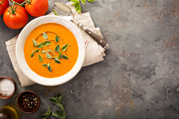 Tomato soup with olive oil and herbs