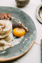 dumplings with potatoes, cheese, berries, compositions for the menu of the restaurant, decorated with greens and sauce