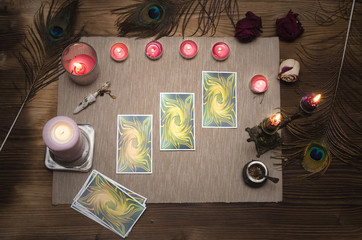 Tarot cards on wooden desk table. Fortune teller.