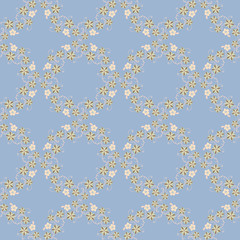 vector seamless pattern with delicate flower wreaths on a blue background