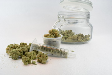 Medical marijuana with medical tools, jar, and pipe
