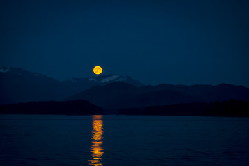 Fullmoon with mountain landscape