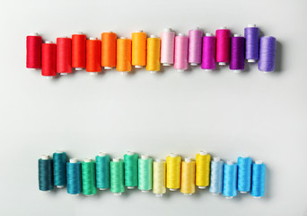 Many colorful threads on white background