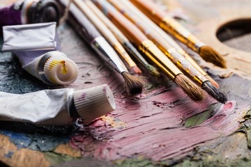 Oil paints and paint brushes.