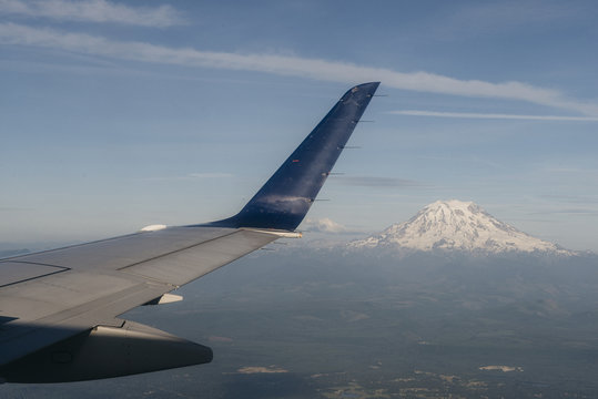 Airplane Flying Past Volcano